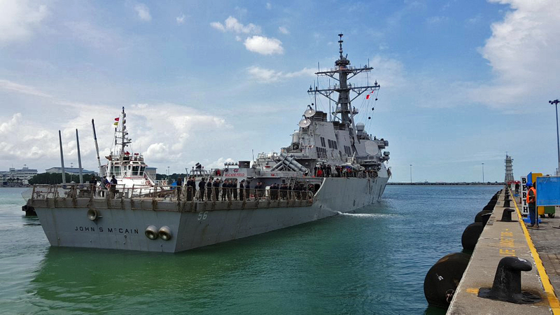 The USS John S. McCain arrives pier side at Changi Naval Base, in Singapore following a collision (US Navy photo by Mass Communication Specialist 2nd Class Joshua Fulton/Released)